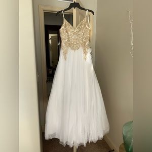 Beautiful prom gold and white prom dress. Never been worn. Size three in juniors